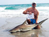 Chris Salomoni with a blacktip shark caught during the 2011 Blacktip Challenge shark fishing tournament in Florida